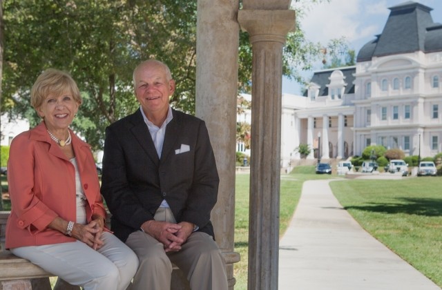 Cathy and Pete Miller pose for a portrait on the front lawn of Brenau's Historic Gainesville Campus. (AJ Reynolds/Brenau University)