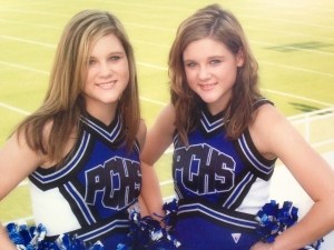 Meadows sisters in matching blue and white cheerleading outfits for PCHS.