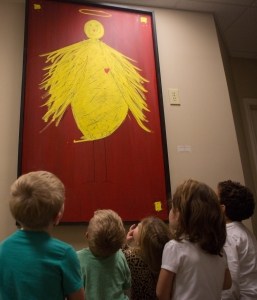 "Isabel Athena" by Frank Norton, Jr., Yellow chicken on red background.