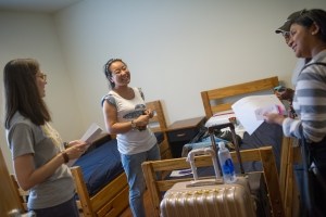 Cathy Wu, center, smiles inside her room inside the New Hall student residence while talking with Jordan Anderson, right, and Amanda Buchanan. ( AJ Reynolds/Brenau University)