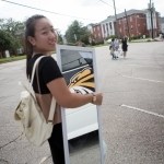 Cathy Wu holds a mirror she bought on her first shopping trip to Walmart. (AJ Reynolds/Brenau University)