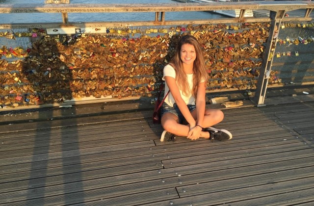 Madison Kosater poses for a photo of the locks on the Pont des Arts bridge in Paris.
