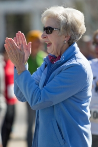 Marsha Dempsey cheers as her family members near the finish line during the Dempsey Dash 5K, a race celebrating the memory of Brenau's longtime Executive Vice President and CFO Wayne Dempsey, on Saturday, March 11, 2017. (AJ Reynolds/Brenau University)