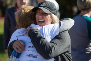 Nita Tammarine gets a hug from Danielle Miller, right, after finishing the Dempsey Dash 5K, a race celebrating the memory of Brenau's longtime Executive Vice President and CFO Wayne Dempsey, on Saturday, March 11, 2017. (AJ Reynolds/Brenau University)