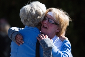 Nita Tammarine hugs Marsha Dempsey during the Dempsey Dash 5K, a race celebrating the memory of Brenau's longtime Executive Vice President and CFO Wayne Dempsey, on Saturday, March 11, 2017. (AJ Reynolds/Brenau University)