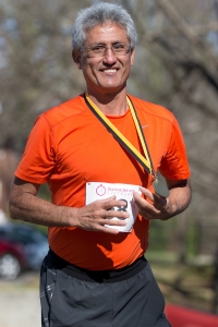 Alberto Murillo reacts after getting his medal during the Dempsey Dash 5K, a race celebrating the memory of Brenau's longtime Executive Vice President and CFO Wayne Dempsey, on Saturday, March 11, 2017. (AJ Reynolds/Brenau University)