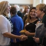 Patricia Wolfe, left, shakes hands with Gale Starich, dean of the College of Health Sciences, during the 4th Annual Women's Leadership Colloquium on Friday, March 17, 2017. (AJ Reynolds/Brenau University)