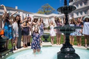 Savannah Romans and her Phi Mu sisters celebrate her engagement after she was thrown into the Grace Hooten Moore Memorial Fountain. (AJ Reynolds/Brenau University)