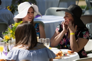 Nayhene Rosa WC '13, left, and Caylen Perry WC '15, reminisce during the Champagne Brunch. (AJ Reynolds/Brenau University)