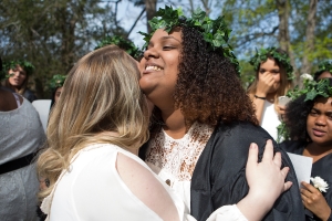 Hannah Vigil-Shuck, a rising senior, gets a hug from Sara Hubaishi, a graduating senior, after ascending the Crow's Nest. (AJ Reynolds/Brenau University)