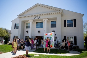 Alumnae and current students gather and mingle outside the Zeta Tau Alpha sorority house. (AJ Reynolds/Brenau University)
