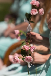 May Court members hold roses as they take their seats. (AJ Reynolds/Brenau University)