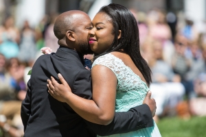 Quonna Holden gets a hug from her father, Demond Smith during May Day. (AJ Reynolds/Brenau University)