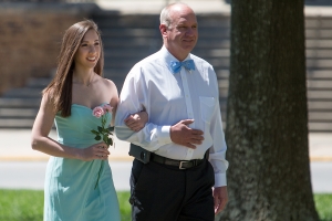 Junior May Court representative Lauren Sanders is escorted by her father. (AJ Reynolds/Brenau University)