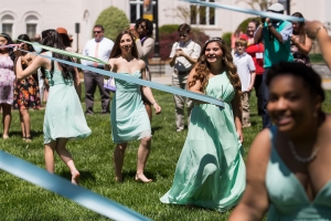 Nancy Benitez, right, and Lauren Sanders wrap the Maypole. (AJ Reynolds/Brenau University)
