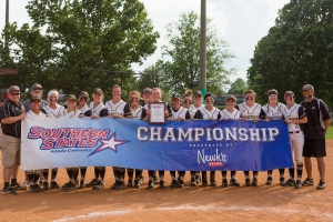 Brenau players and coaches pose with the SSAC banner after winning the championship game of the SSAC conference tournament against Mobile. Brenau won 2-1 in nine inning. Brenau's finished SSAC play, both regular season and the conference tournament 30-0. (AJ Reynolds/Brenau University)