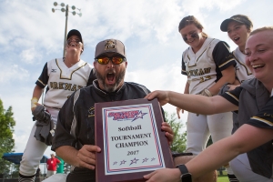 Brenau head coach Devon Thomas reacts after being dunked with water after the championship game of the SSAC conference tournament against Mobile. Brenau won 2-1 in nine inning. Brenau's finished SSAC play, both regular season and the conference tournament 30-0. (AJ Reynolds/Brenau University)
