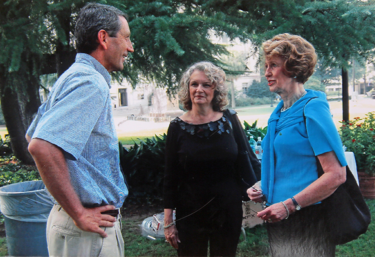 Mary Ross, right, is pictured with U.S. Rep. Mark Sanford, left, former governor of South Carolina, and Nancy Bunch, current curator at the mansion.