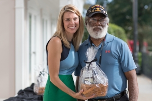 Brooke Bargeron Statham, WC '00, presents Claude Porter, BU '84, with an award symbolizing his induction into the Alumni Hall of Fame as part of the Alumni Awards during the homecoming celebrations at Brenau University. (AJ Reynolds/Brenau University)