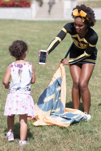 Gloria Clark shows a student child a photo from her iPhone during the homecoming celebrations at Brenau University. (AJ Reynolds/Brenau University)