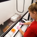 Taylor Carpenter works to place a cover slip on a slide during a research project for Dr. Jessi Shrout, assistant professor of biology, and Dr. Heather Ross, associate professor of physical therapy, studying rat brains that have been carefully frozen and preserved for the purpose of studying the effects of stem cells in repairing brain tissue and subsequent function. (AJ Reynolds/Brenau University)