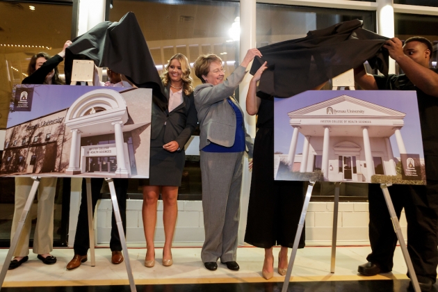 Brenau health sciences students Bethany Green, Chandy Henson, Savannah Blalock, Dean of the Ivester College of Health Sciences Gale Starich, Ivie Hall and Martis Ferguson unveil renderings of the future letterings of Brenau's Downtown Center and Brenau East in Gainesville during an event announcing the naming of the Brenau University Ivester College of Health Sciences. (AJ Reynolds/Brenau University)