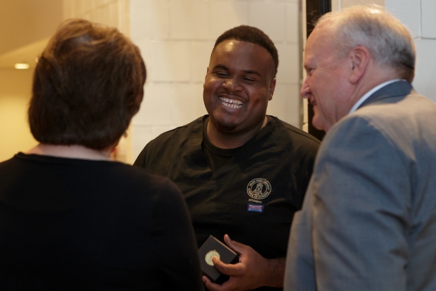 Martis Ferguson laughs while speaking with Kimberly and David Barnett during an event announcing the naming of the Brenau University Ivester College of Health Sciences. (AJ Reynolds/Brenau University)