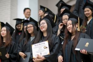 Members of the first cohort of the 2+2 partnership between Anhui Normal University and Brenau University smile with their diplomas following the 2018 Spring Commencement Ceremony on Saturday, May 5, on Brenau University’s historic Gainesville campus. (Nick Bowman for Brenau University)