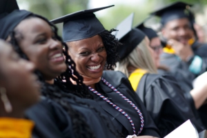 Students laughing during commencement