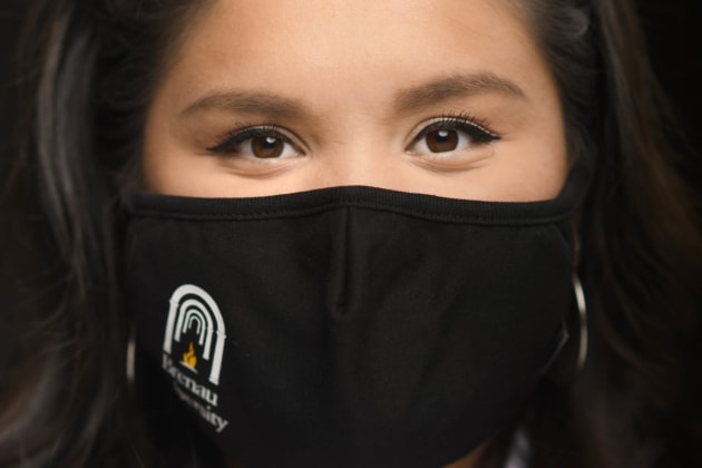 Nancy Benitez wearing a cloth mask with the Brenau University logo