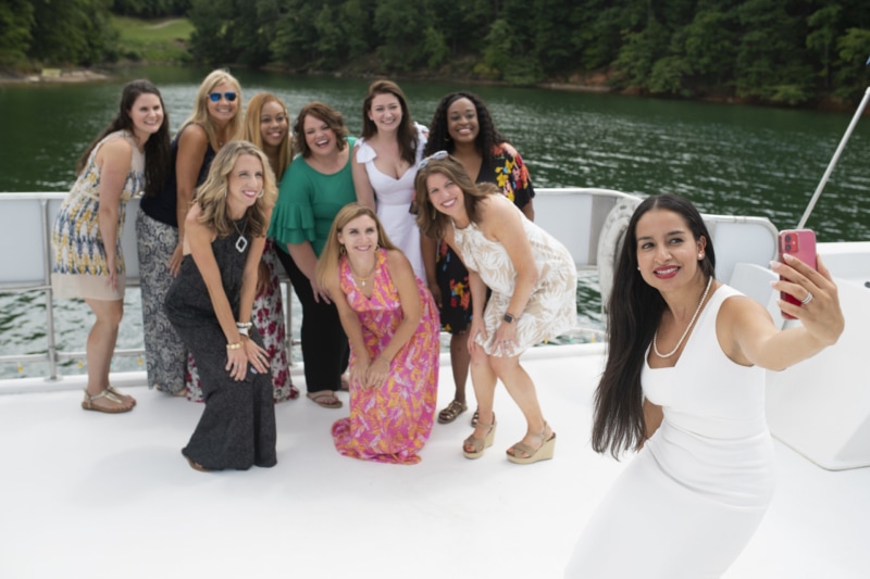 Brenau's first cohort of the EWMBA takes a picture on a boat.