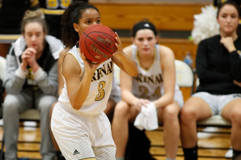 Autumn Dodson playing basketball during her time at Brenau.